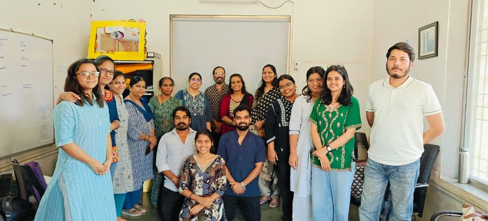 A group photo of CREA staff and TISS M Ward staff who organised the training. Three people are kneeling in the centre while the rest stand behind them in a semi-circle