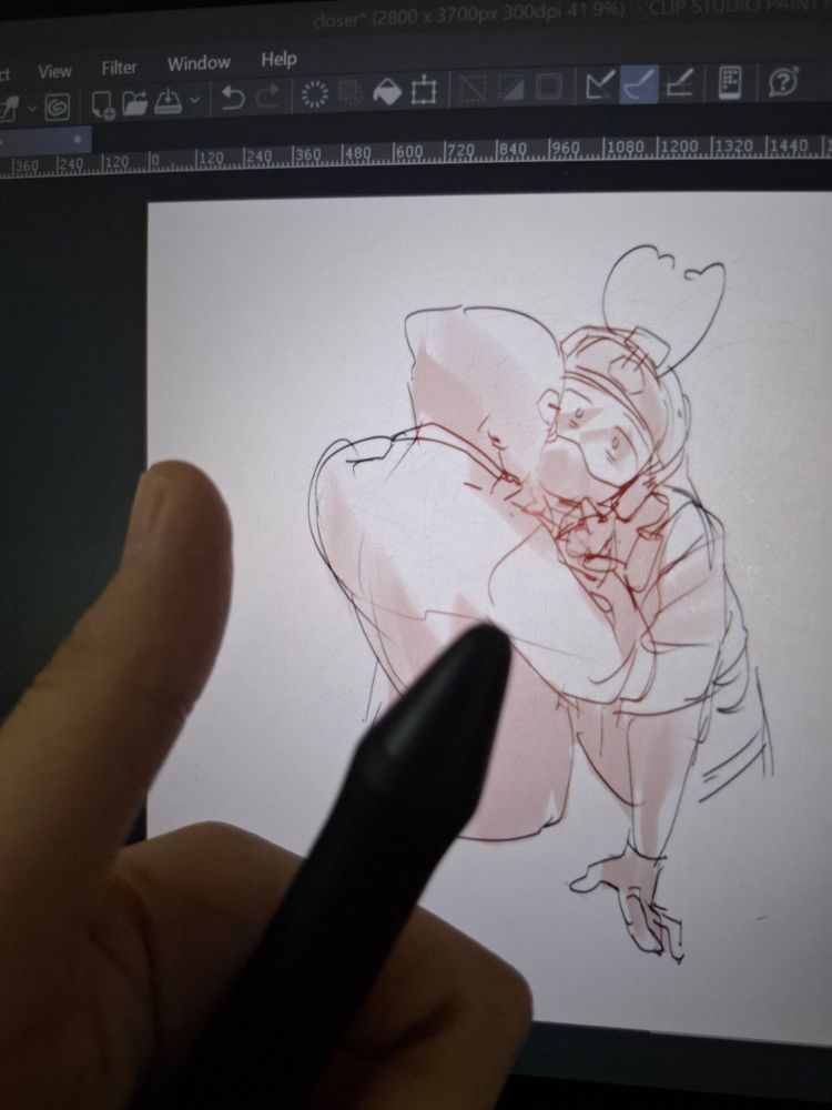 hand holding a tablet pen which its nib broke and flew away