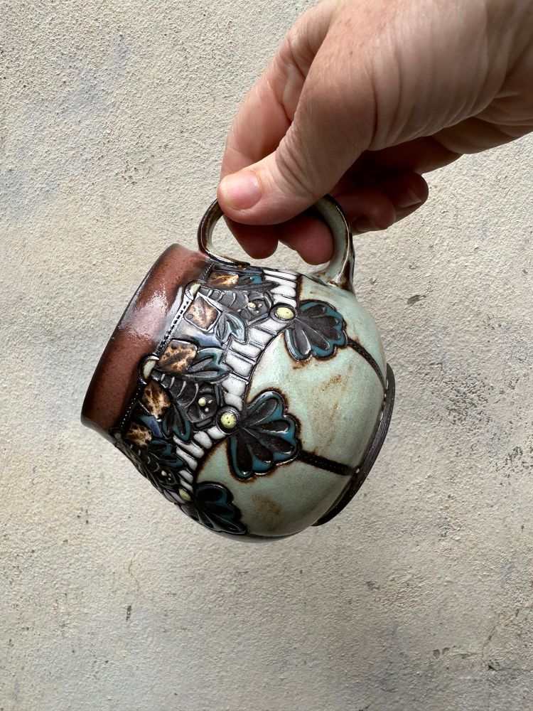 Patterned, rustic mug.