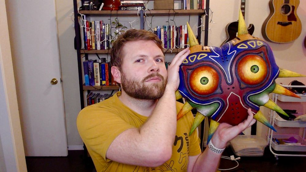 a picture of me, holding the dope Majora's Mask replica my brother-in-law made