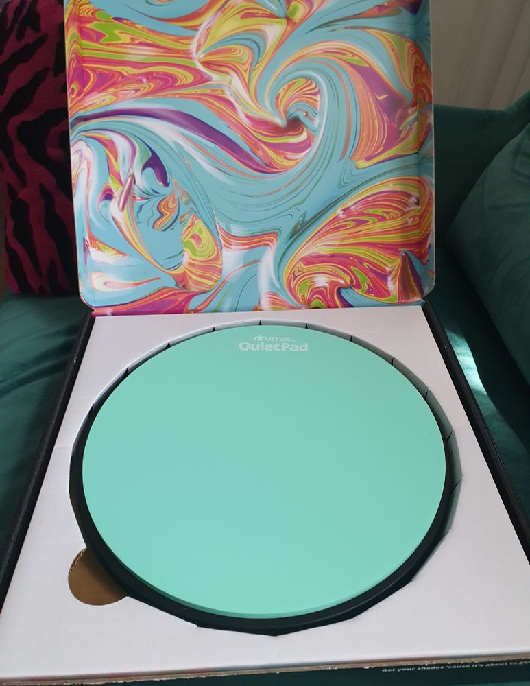 inside the box is a mint green quiet pad