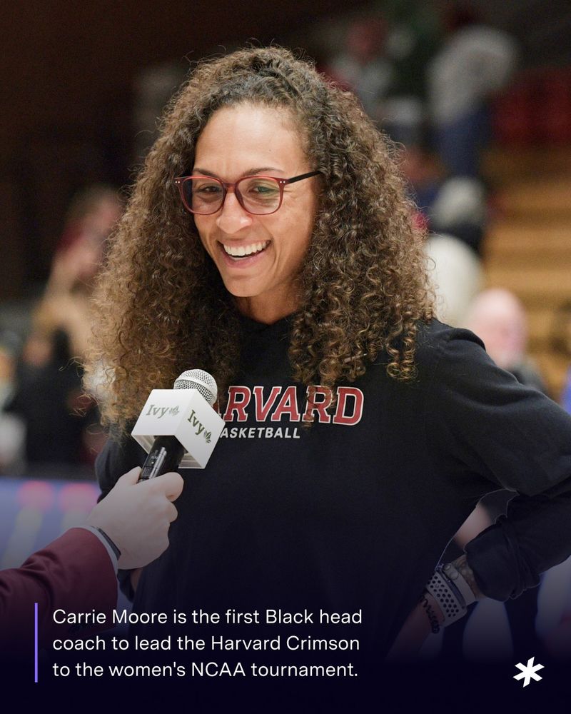 Carrie Moore speaking into a microphone. Text below the image reads: Carrie Moore is the first Black head coach to lead the Harvard Crimson  to the women's NCAA tournament.