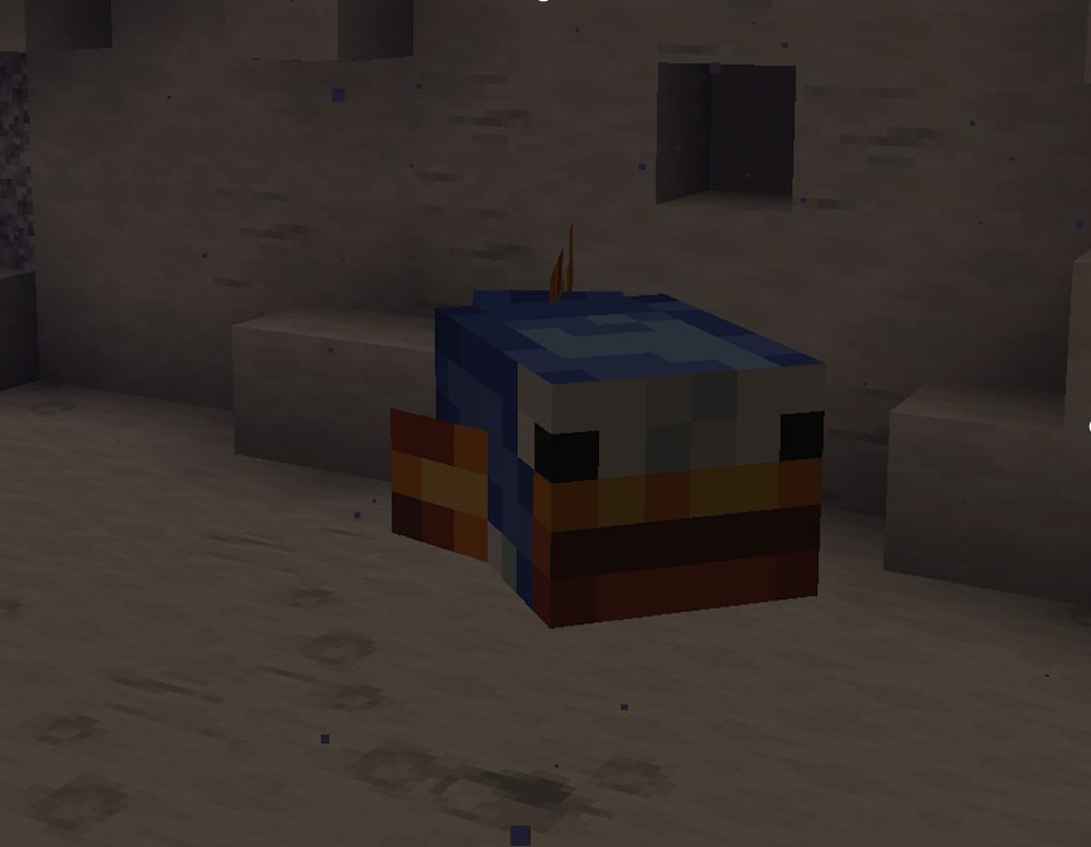 A Minecraft screenshot showcasing a modded mob from the Alex's Mobs mod retextured in a Mario theme. It is a Blobfish retextured to look like the Rip Van Fish from Super Mario World