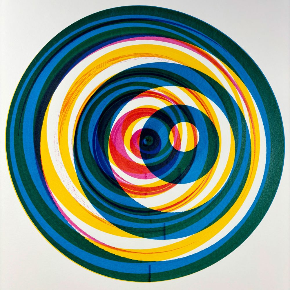 Concentric multicolored rings in yellow, blue, green, and red spiral inward on a white background, forming a vibrant vortex-like composition.