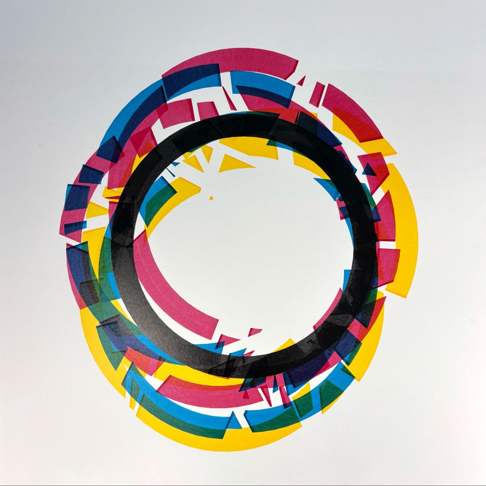 circular abstract artwork composed of overlapping arc segments in black, cyan, magenta, and yellow. The arcs are fragmented and misaligned, forming a disrupted ring that surrounds a clean central void. The overlapping transparent colors create purples, greens, and oranges, producing a dynamic interplay of hue and structure.