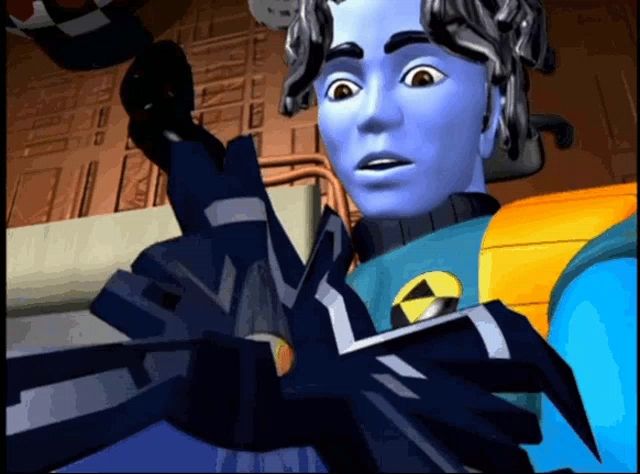 a cartoon character with blue hair and a yellow triangle on his chest