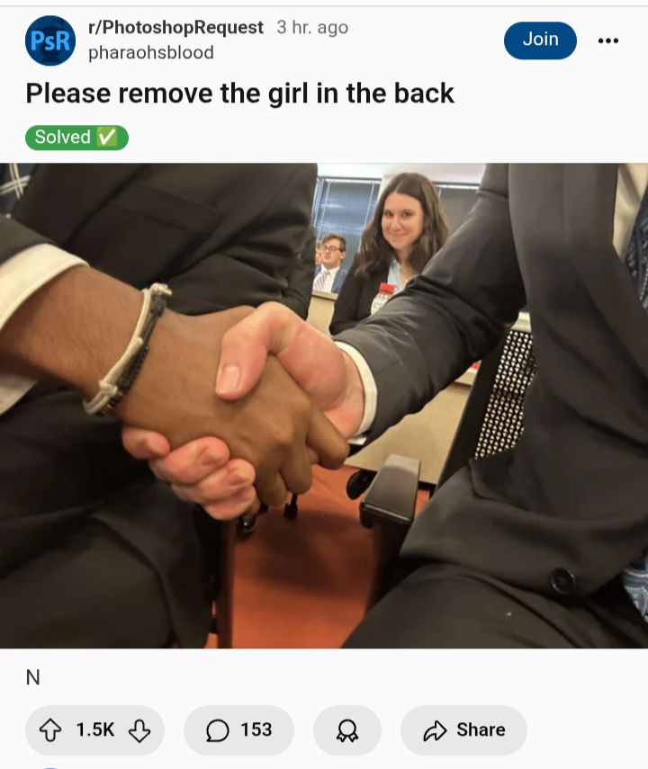 A picture of two hands shaking a smirking woman in the background