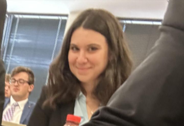A close up of the smirking woman from the previous picture