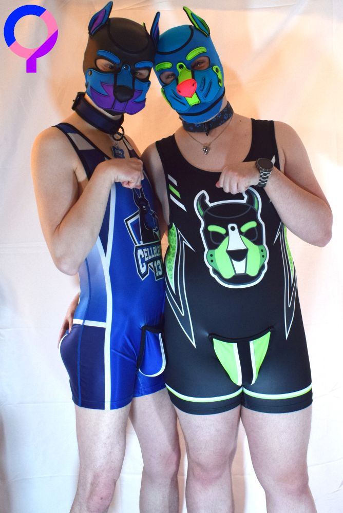 Picture of Qoppa and Rocky wearing singlets about to fistbump