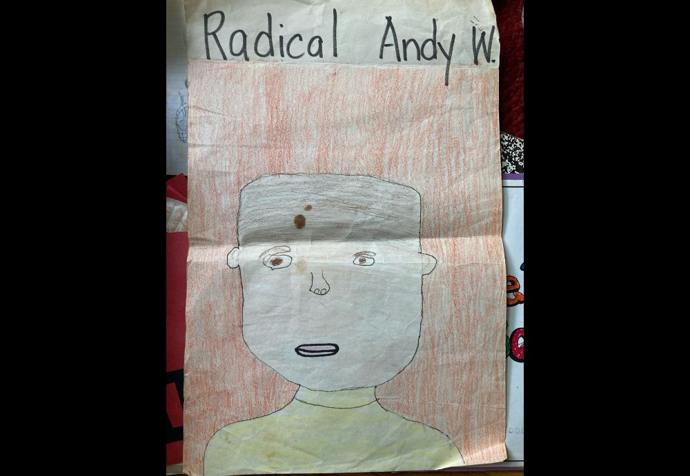 Portrait of a very expression-less face drawn by an elementary school child, titled “Radical Andy W.”