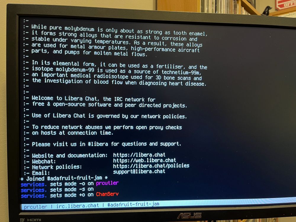 A picture of a monitor filled with text - the text is the introduction when joining the Libera Chat server.  It shows me connected to it and joining the fruit-jam channel in IRC