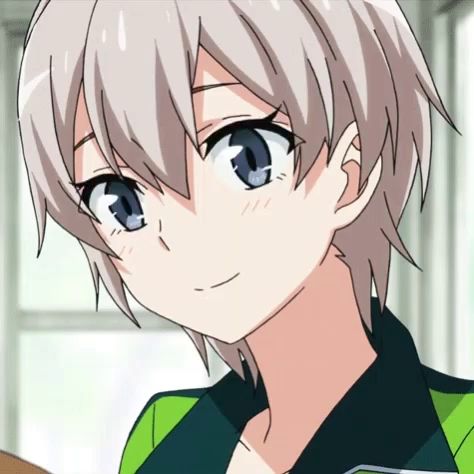 a girl with short white hair and blue eyes is wearing a green and black shirt