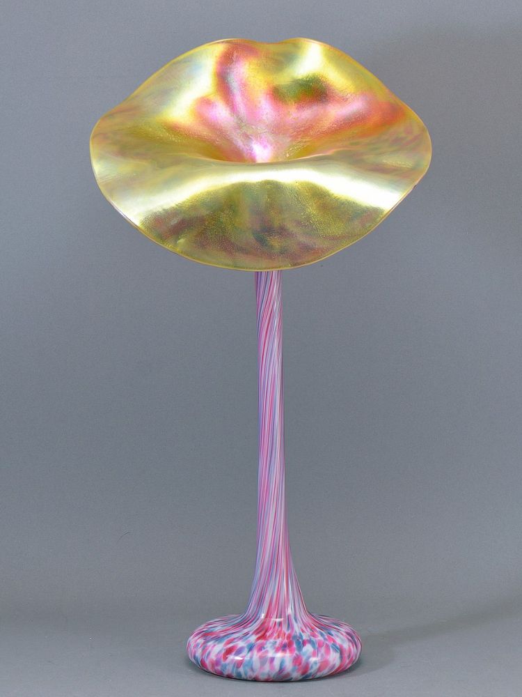the jack in the pulpit vase with heavily iridized floriform mouth and tall skinny pulled neck of pink blue and white glass.
