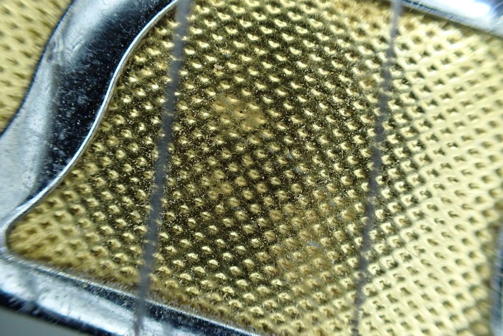 a close up of the golden chromed pick-up

all macro photographs for macro photography month