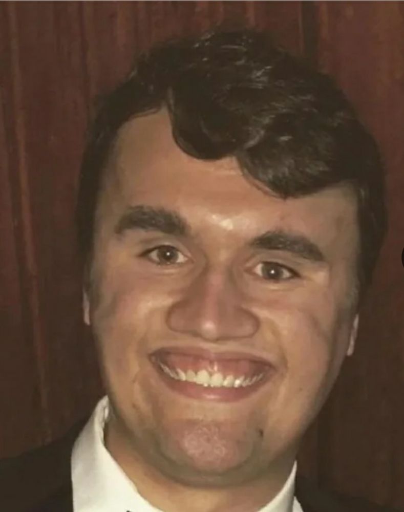 Picture of Charlie Kirk trying to smile. He looks like he can suck out your soul by eye contact alone.