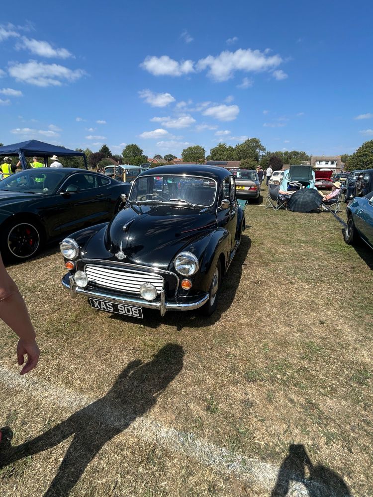 An old Morris Car in a field 