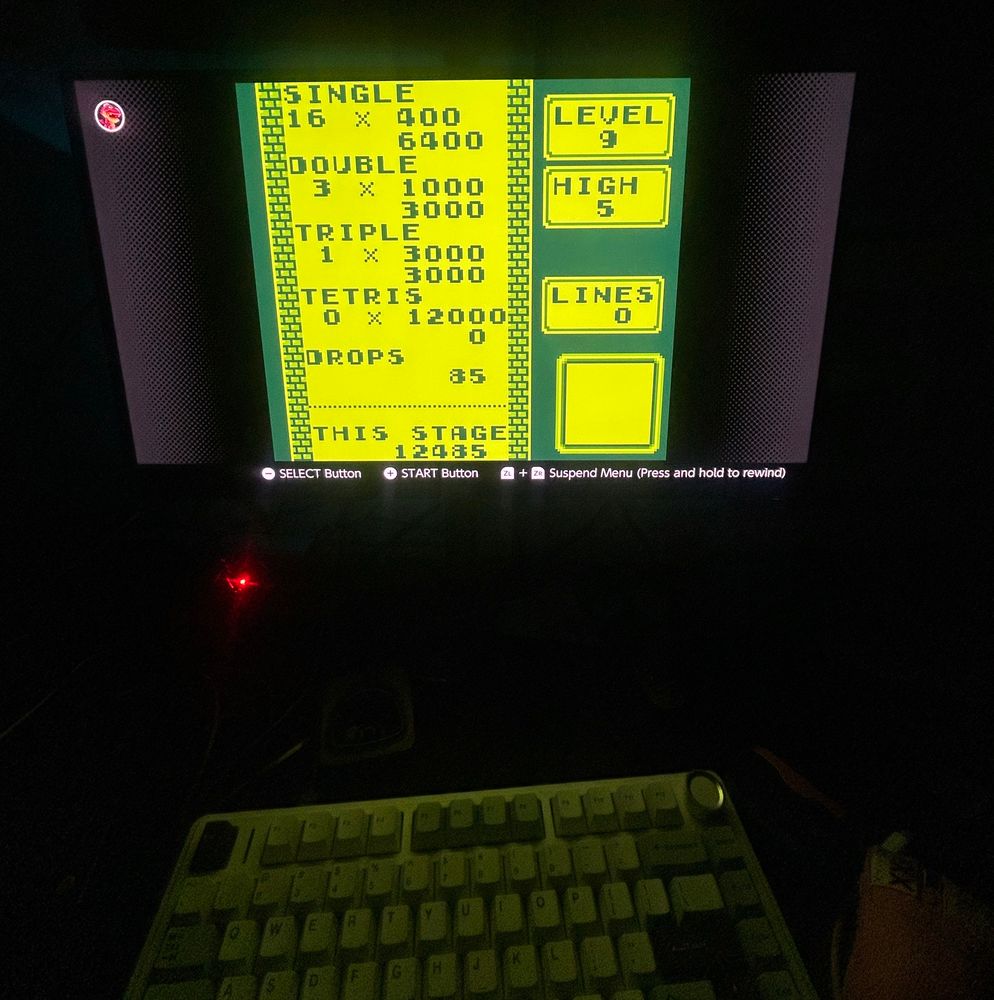 A picture of a Alienware AW2725DF QD-OLED Monitor playing GB Tetris on Switch Online