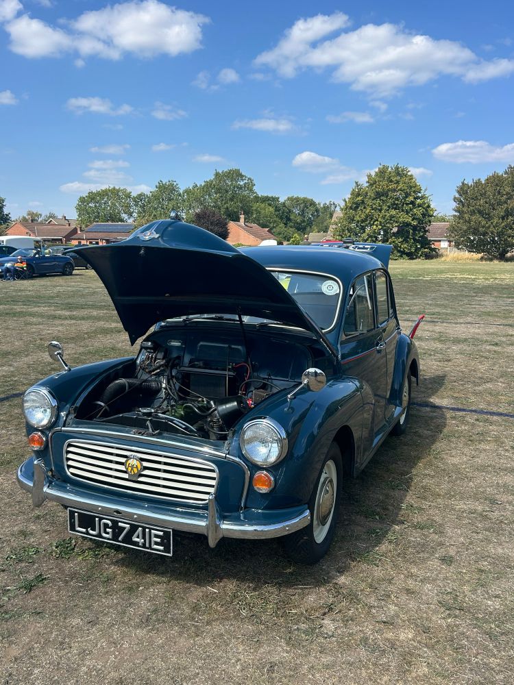 An old Morris Car in a field 