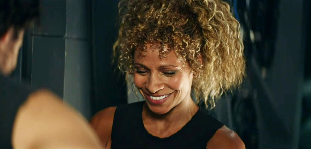 Raffi looking down and smiling. 