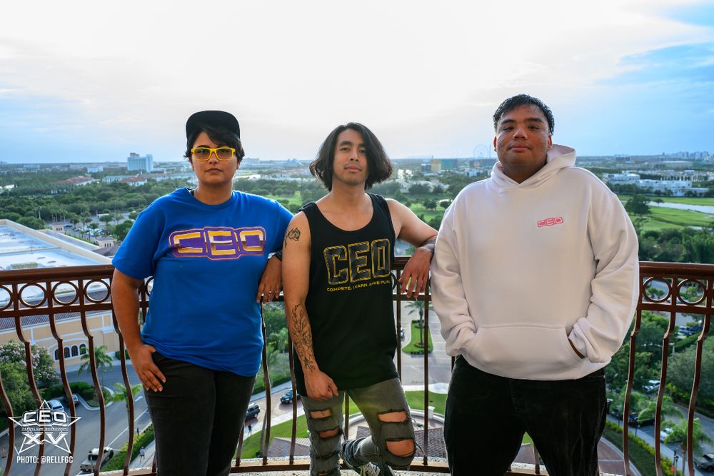 kurominah, JustASpirit, and Frank Lotion modeling CEO 2025 merch.