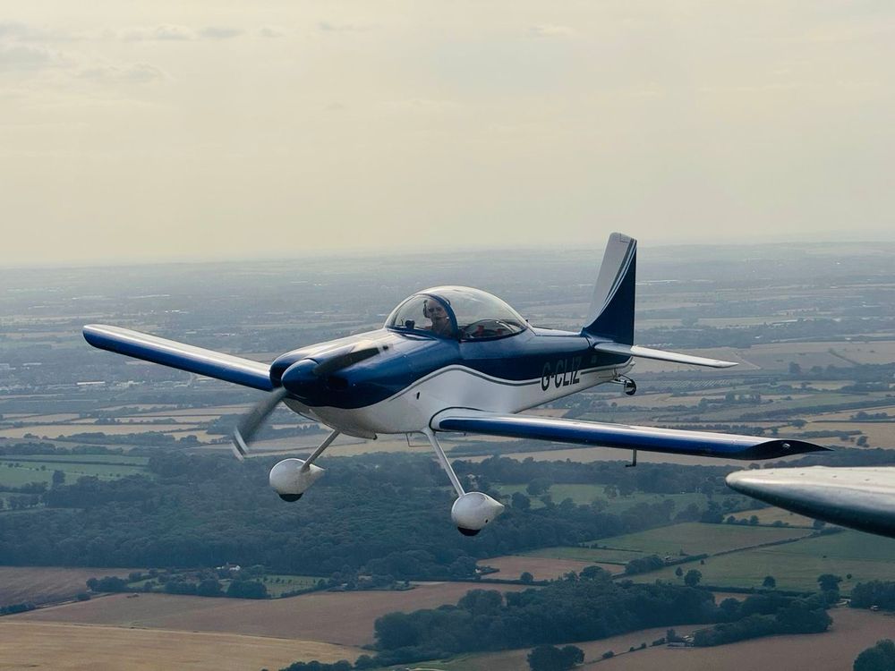 A Vans RV8 aircraft as seen from the formation lead aircraft 