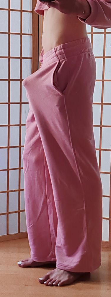 Femboy wearing a matching sweatpants and crop top sweater, showing tummy, feet and a boner?