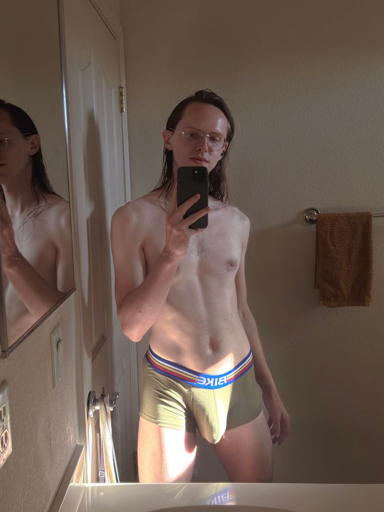 A mirror selfie of me in some green Bike trunk underwear. The sun is shining of my bulge and this