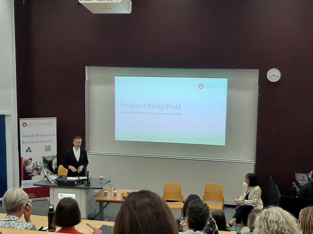 Prof Philip Dodd speaking in front of a large lecture theatre