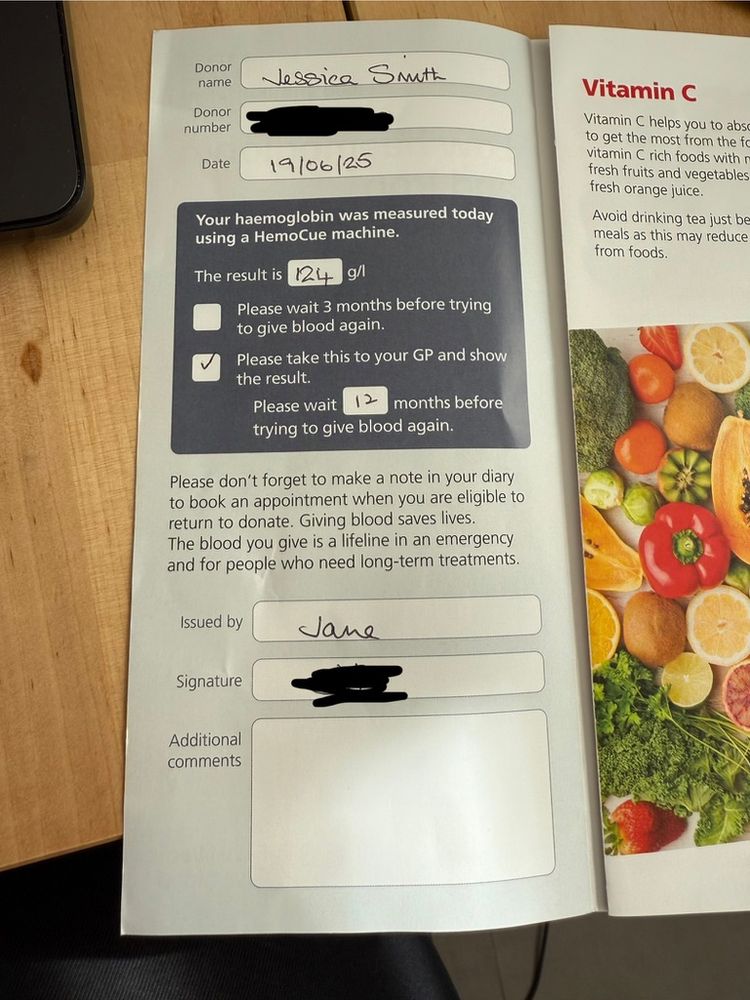 Photo of a leaflet given out by NHS Blood and Transplant stating a level of 124 g/L and to take this reading to my GP. It also says I will need to wait 12 months before trying to give blood again. Signed by the donor carer, Jane.
