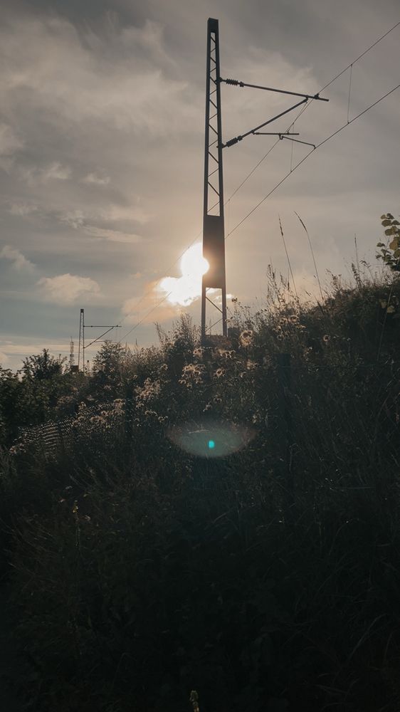 Photos of train tracks in a sunset