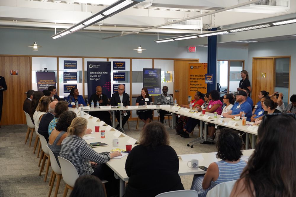 Advocates and local leaders listen to Rep. Ayanna Pressley provide remarks. 