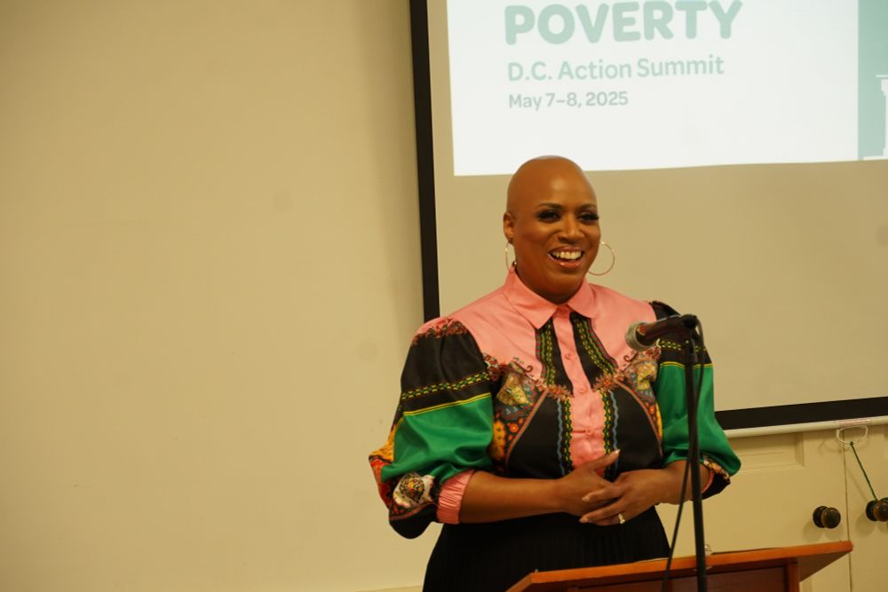 Rep. Ayanna Pressley smiles while delivering remarks. 