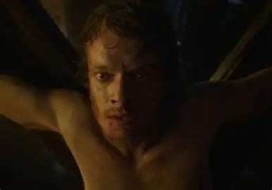 Screen capture from Games of Thrones. Close up of Theon Greyjoy’s terrified face while he is tied up and about to have something important removed while he’s being tortured.