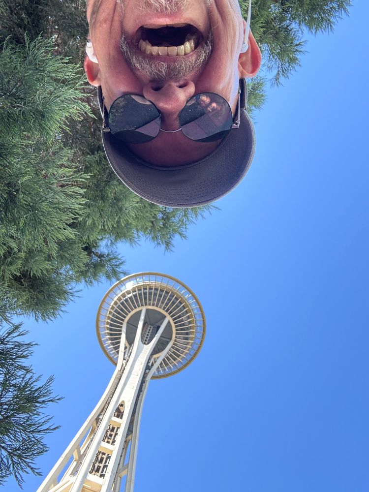 Looking up at the space needle! Scott’s face extends in from the top in an upside down selfie. The bluest sky you’ve ever seen… in Seattle