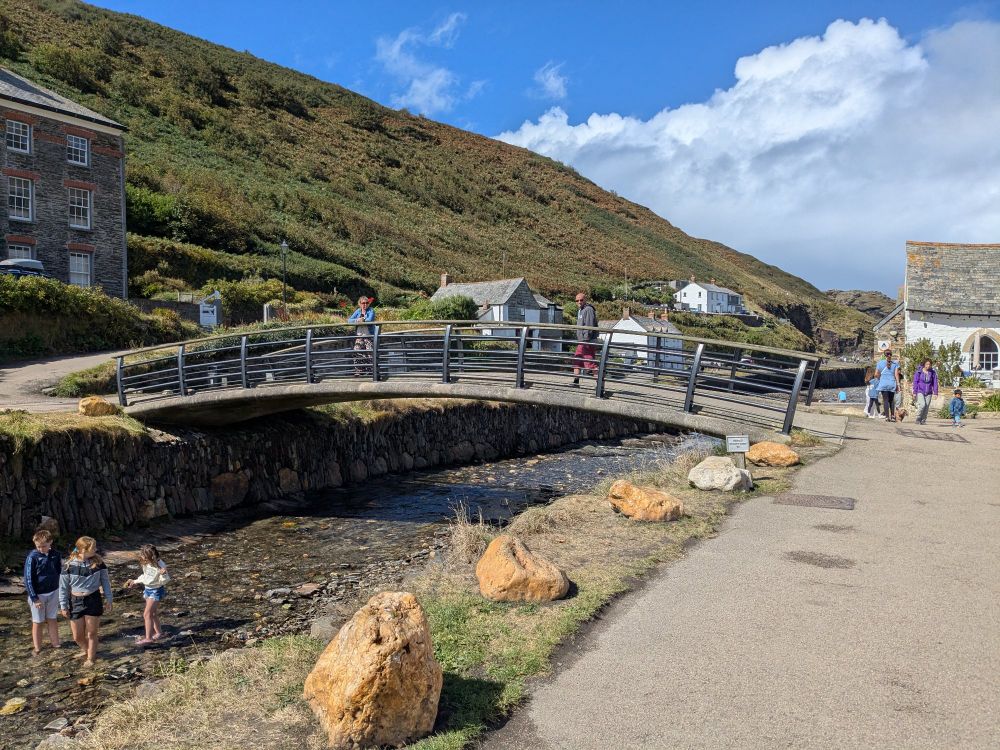 Obligatory bridge photo. This is the new one that was built after the floods damaged the old stone one. The river is shallow today, and children are paddling in it. The skies are blue and it's a lovely peaceful scene.