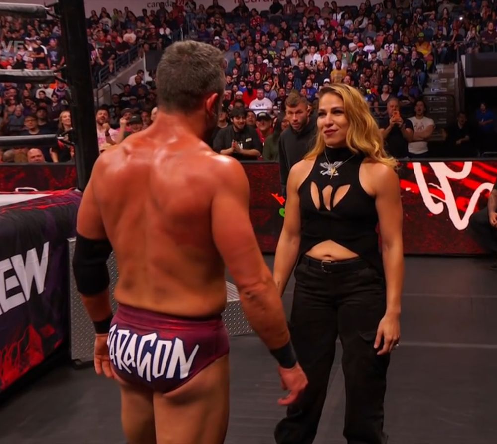 Roderick Strong stands face to face with his wife, Marina Shafir.