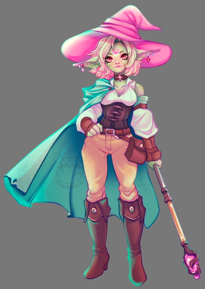 goblin character with light green skin, pointed ears, and short, wavy blonde hair. They wear a wide-brimmed, floppy pink hat, a white blouse with puffed sleeves, a dark brown corset, and tan pants tucked into knee-high brown boots. They have a teal cape fastened with a brooch, and hold a staff with a glowing pink crystal.