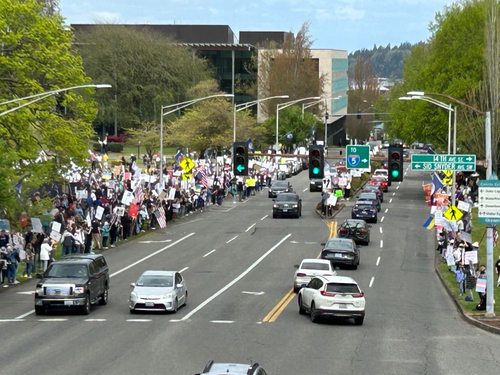 Anti Trump protestors line the streets in front of the Washington state capitol on April 19, 2025