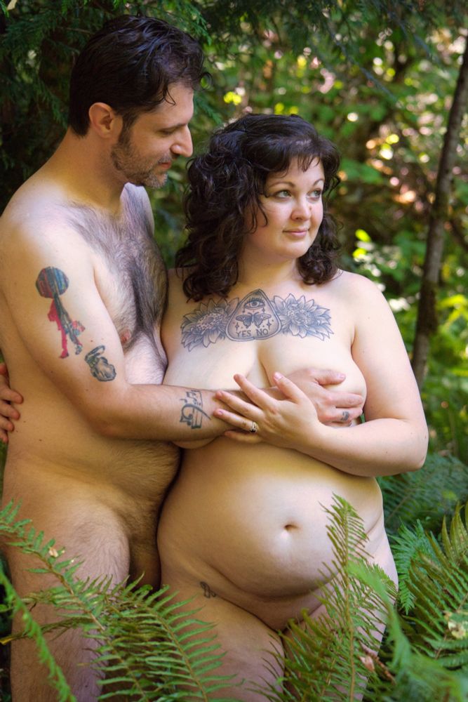 Hades Flambe and Luci Ferocious standing naked amongst the ferns in the forest