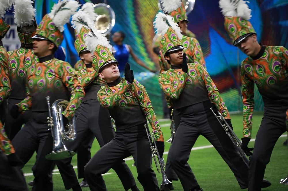 Marching band musicians making cool moves.