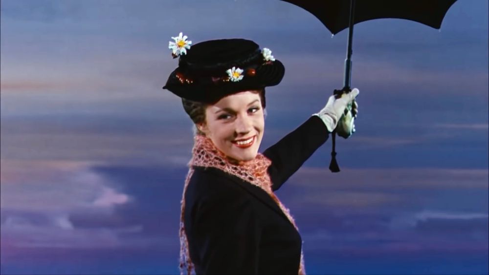 A picture of Mary Poppins smiling and floating away with an umbrella