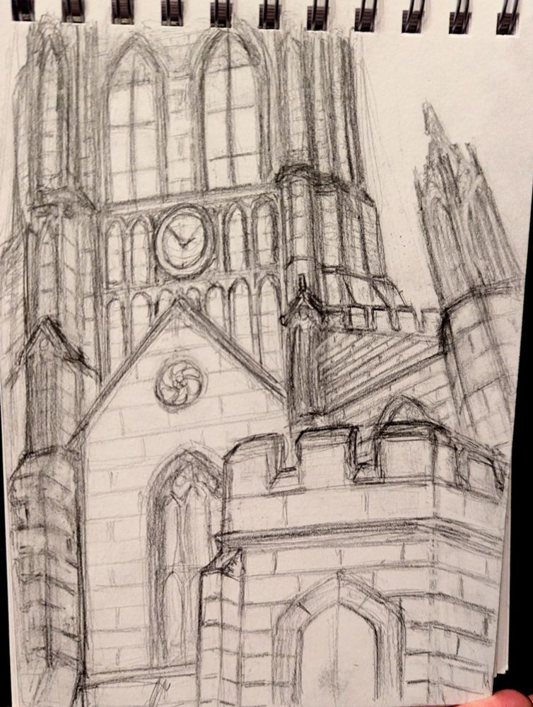 Stained glass windows and a clock on a church