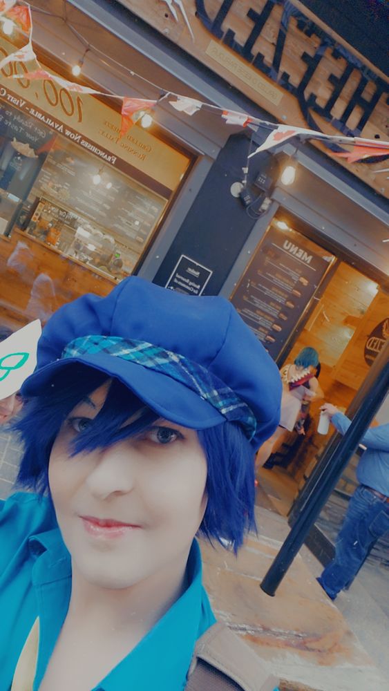 Naoto cosplay in front of Cheezed the Grilled Cheese Restaurant