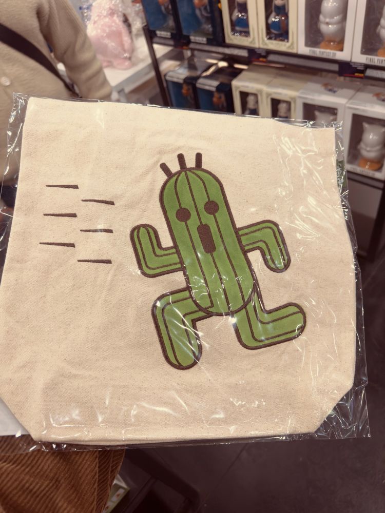 A tote bag with a Cactuar embroidered on top