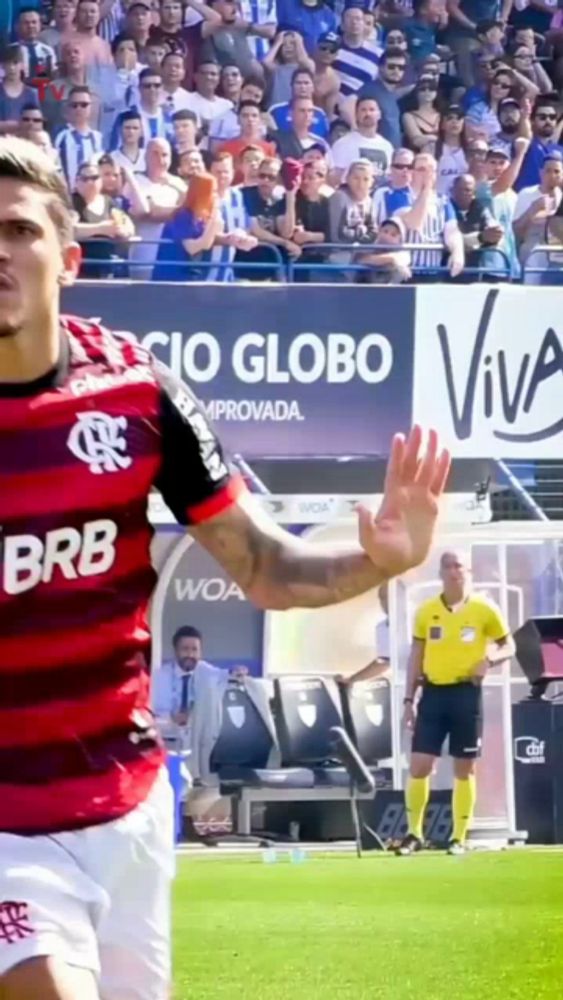 a soccer player wearing a jersey that says brb is waving