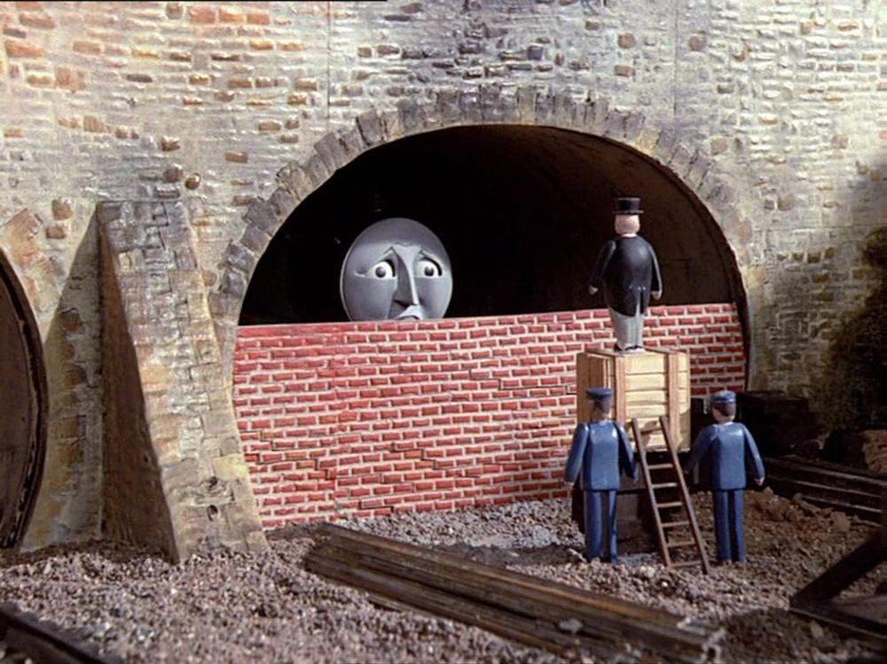 Henry from Thomas the Tank Engine.

He has been bricked up in a shed. He has a look of existential dread on his stupid train face.