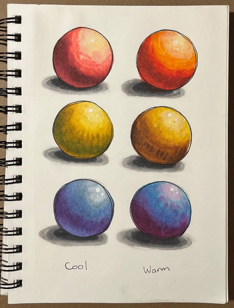 A sketchbook page, on which six spheres are drawn. Each sphere is shaded in a different color scheme, experimenting with the ways different colors interact as highlights and shadows. 