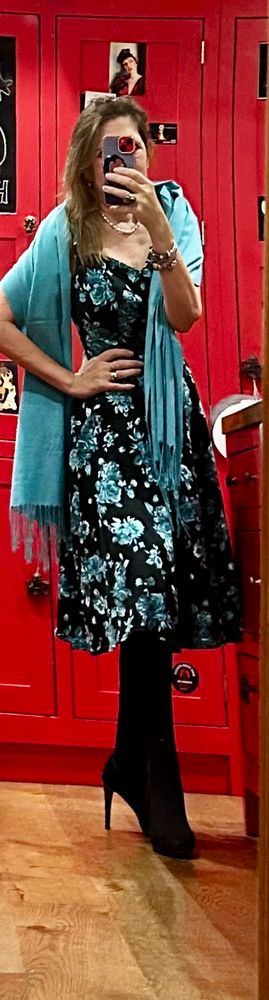 Rosewind in a black tea dress with a sweetheart neckline and strapping shoulders accessorised with a teal shawl which matched the teal roses on the dress…
Also wearing pearl necklace and earrings 
