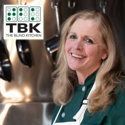 A smiling image of Debra Erickson in an advertisement for the blind kitchen.