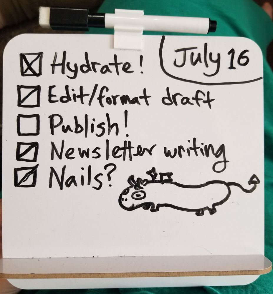 A dry erase to do list with a doodle of a sausage shaped horse with tiny horns, wings, and a pointed devilish tail in the lower right corner.